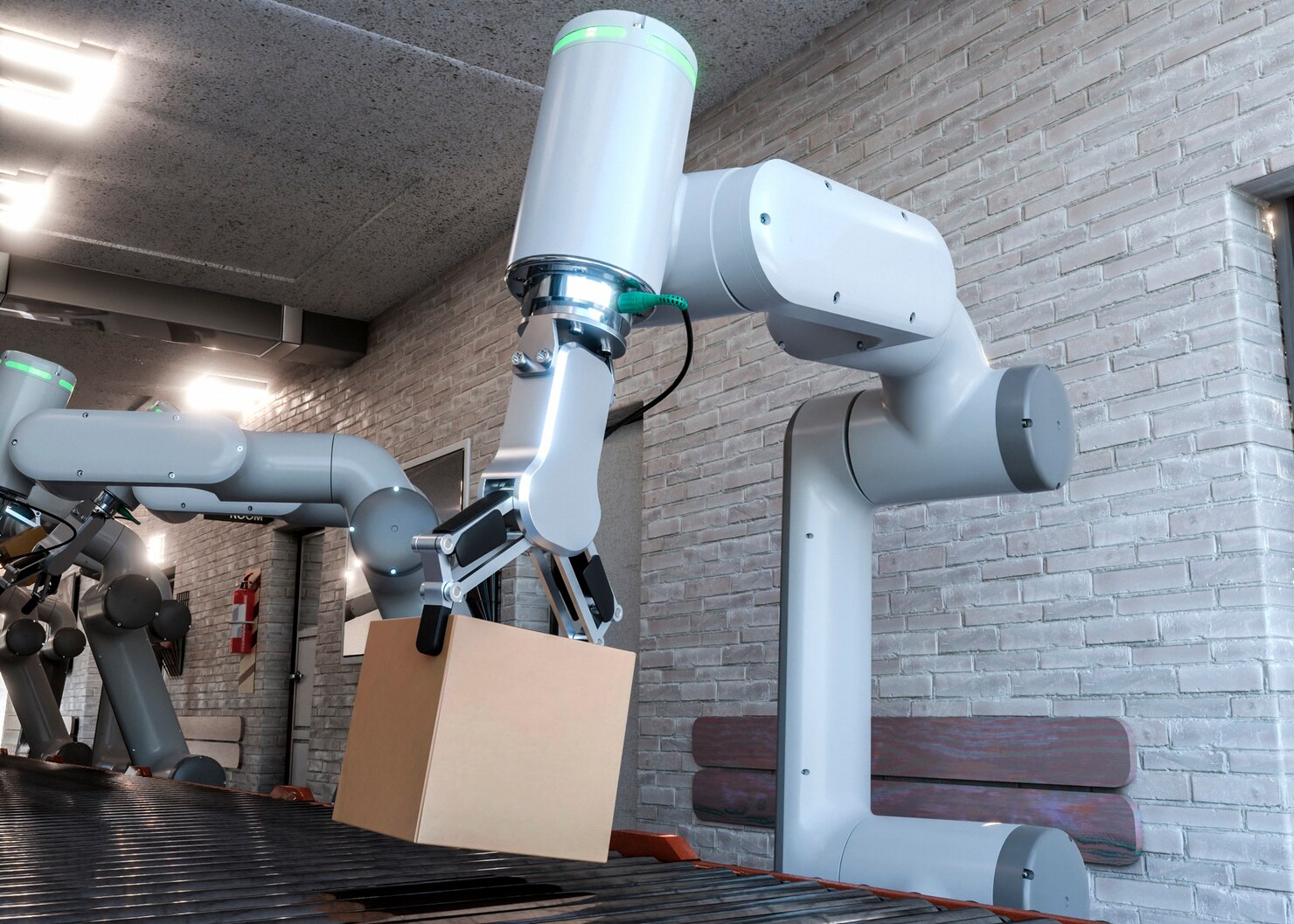 A robotic arm lifts a cardboard box from a conveyor belt in a modern warehouse, highlighting advanced automation technology.