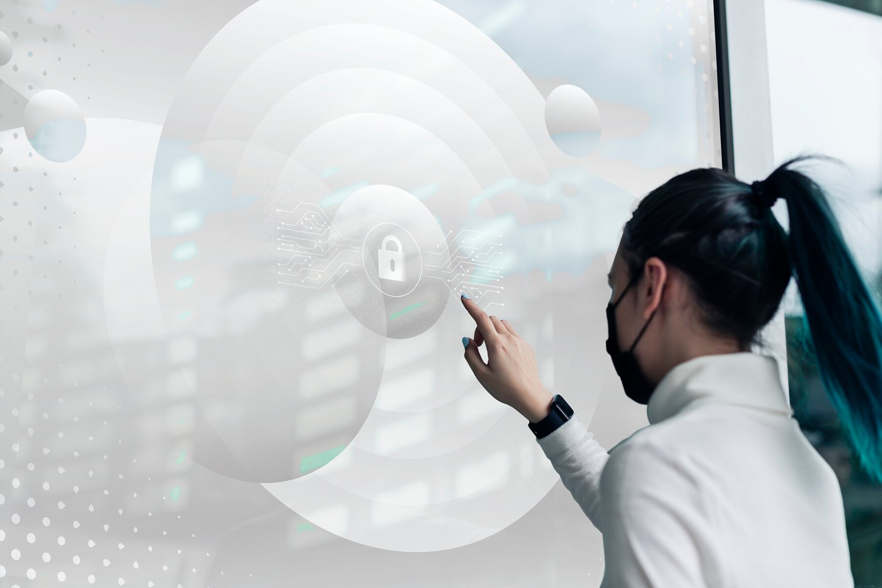 A person interacts with a futuristic touchscreen displaying a padlock symbol and digital elements, signifying cybersecurity.