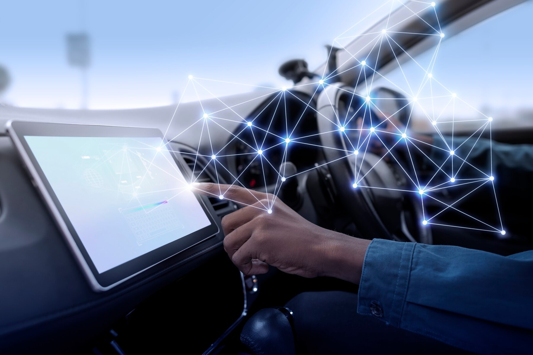 A person interacts with a touchscreen in a car, using hand gestures over digital connections and data visualizations.