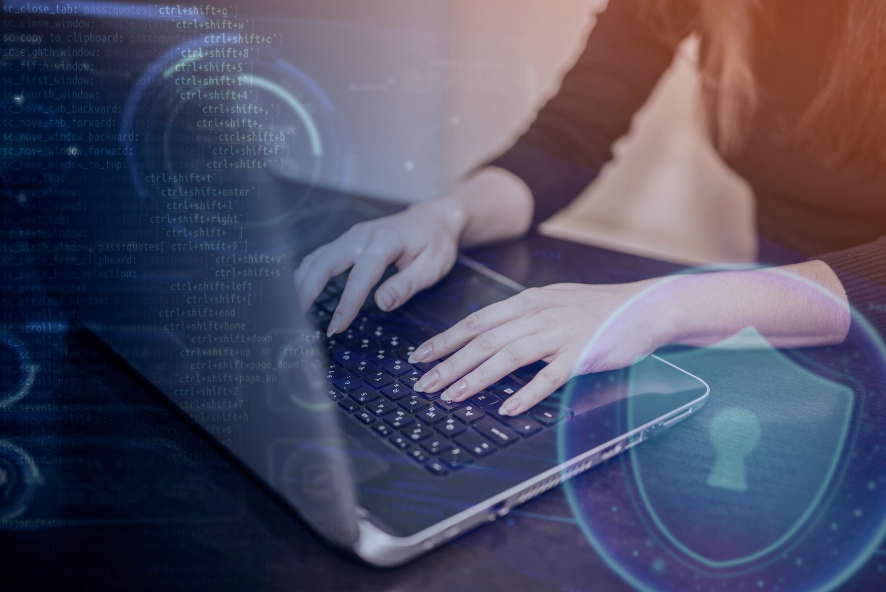 Person typing on a laptop surrounded by digital coding and security symbols, emphasizing technology and cybersecurity themes.