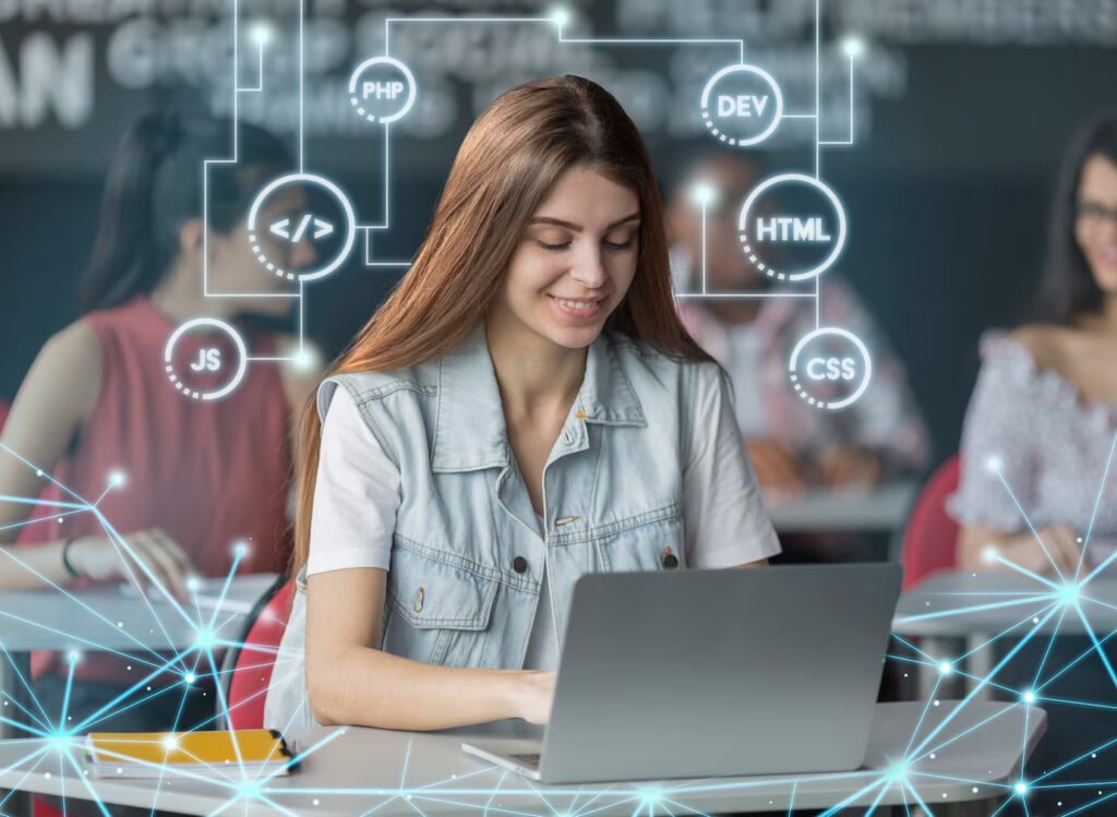 A student sits at a desk with a laptop, surrounded by digital coding symbols like PHP, HTML, and CSS, indicating a tech-focused environment.