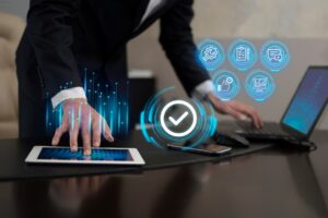 A business professional interacts with a tablet, surrounded by glowing digital icons representing productivity and analytics.