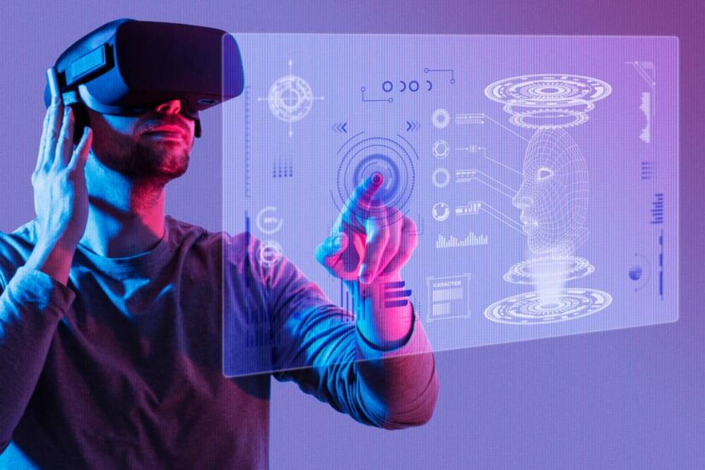 A person wears a VR headset, interacting with a floating holographic interface featuring data graphics and a 3D digital head.