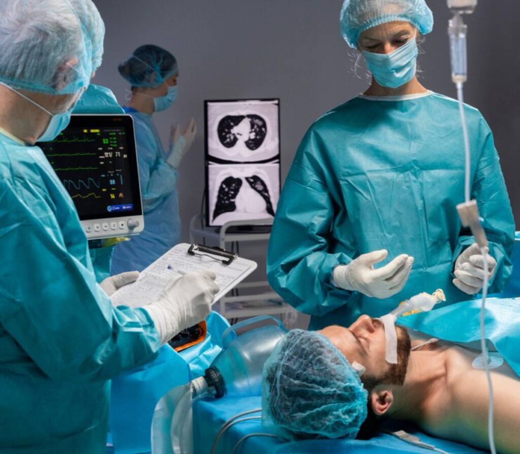 A medical team works on a patient by robotic surgery, with vital signs displayed on monitors and medical charts nearby.