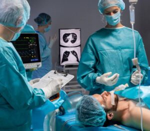 A medical team works on a patient by robotic surgery, with vital signs displayed on monitors and medical charts nearby.