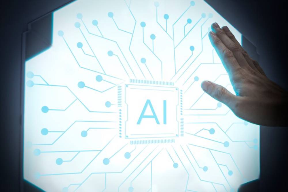 A hand reaching out to an illuminated AI circuit board, symbolizing interaction with artificial intelligence technology.